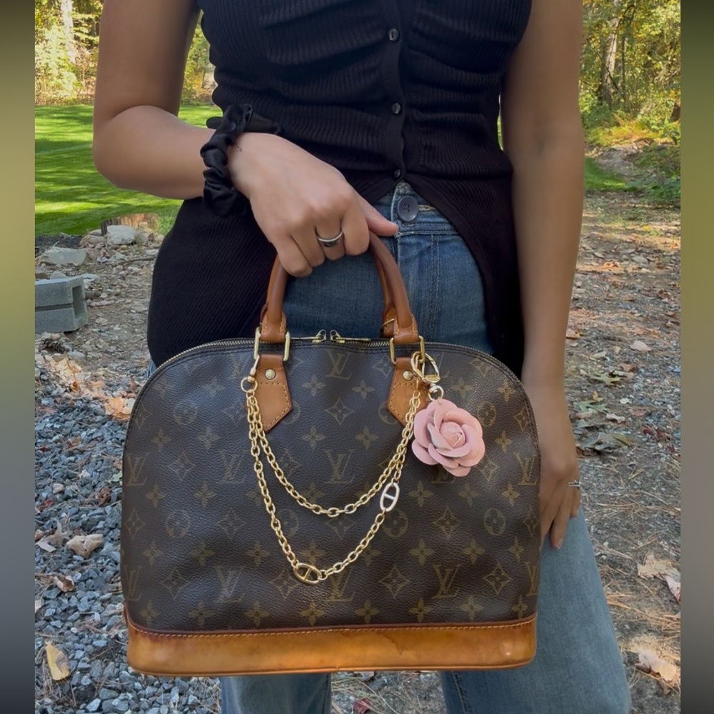 Louis Vuitton Alma PM Handbag with Adjustable Strap, Charm, and COA